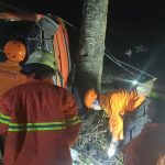 Photo: Ist Trapped: Joint SAR Team evacuates the driver of the overturned fuel truck.
